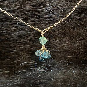 Gold dainty necklace with green and blue gems